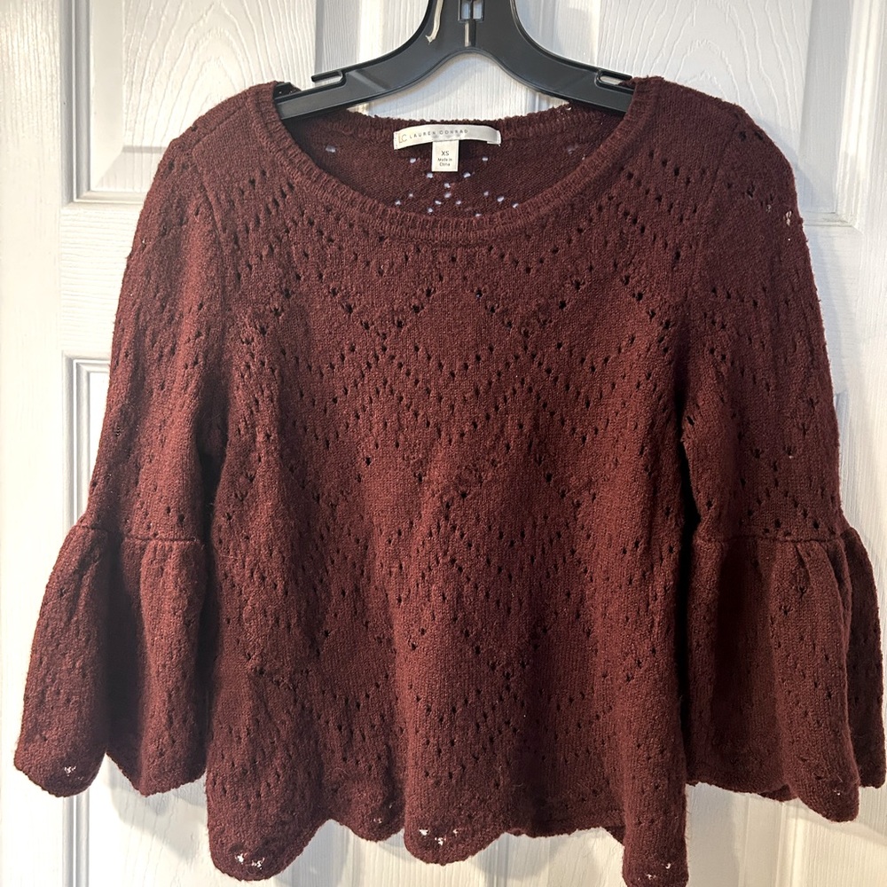 Burgundy knit sweater. Cropped with 3/4 flouncy sleeves.